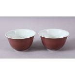 A PAIR OF PINK GROUND TEA BOWLS, six character mark, 9cm diameter.