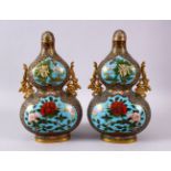 A PAIR OF CHINESE CLOSIONNE DOUBLE GOURD FORMED BOTTLES & COVERS, each decorated with four main