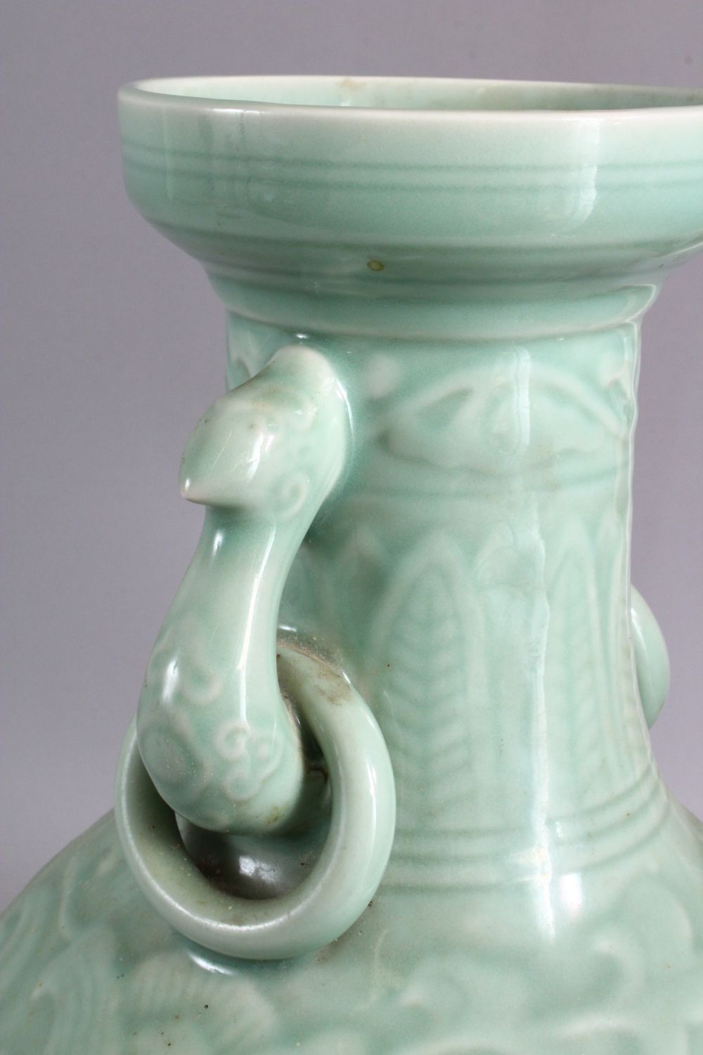 A LARGE CHINESE CELADON PORCELAIN TWIN HANDLE VASE, the body with carved floral decoration beneath a - Image 7 of 9
