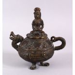AN EARLY CHINESE OR SOUTH EAST ASIAN BRONZE LIDDED OIL LAMP, overall height 13cm, width 12cm.