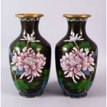 A PAIR OF CHINESE CLOISONNE BLACK GROUND VASES - each with a black ground and native display of