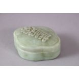 A RARE 19TH CENTURY CHINESE CARVED JADE BOX AND COVER for the Islamic market, of lobed form, the lid