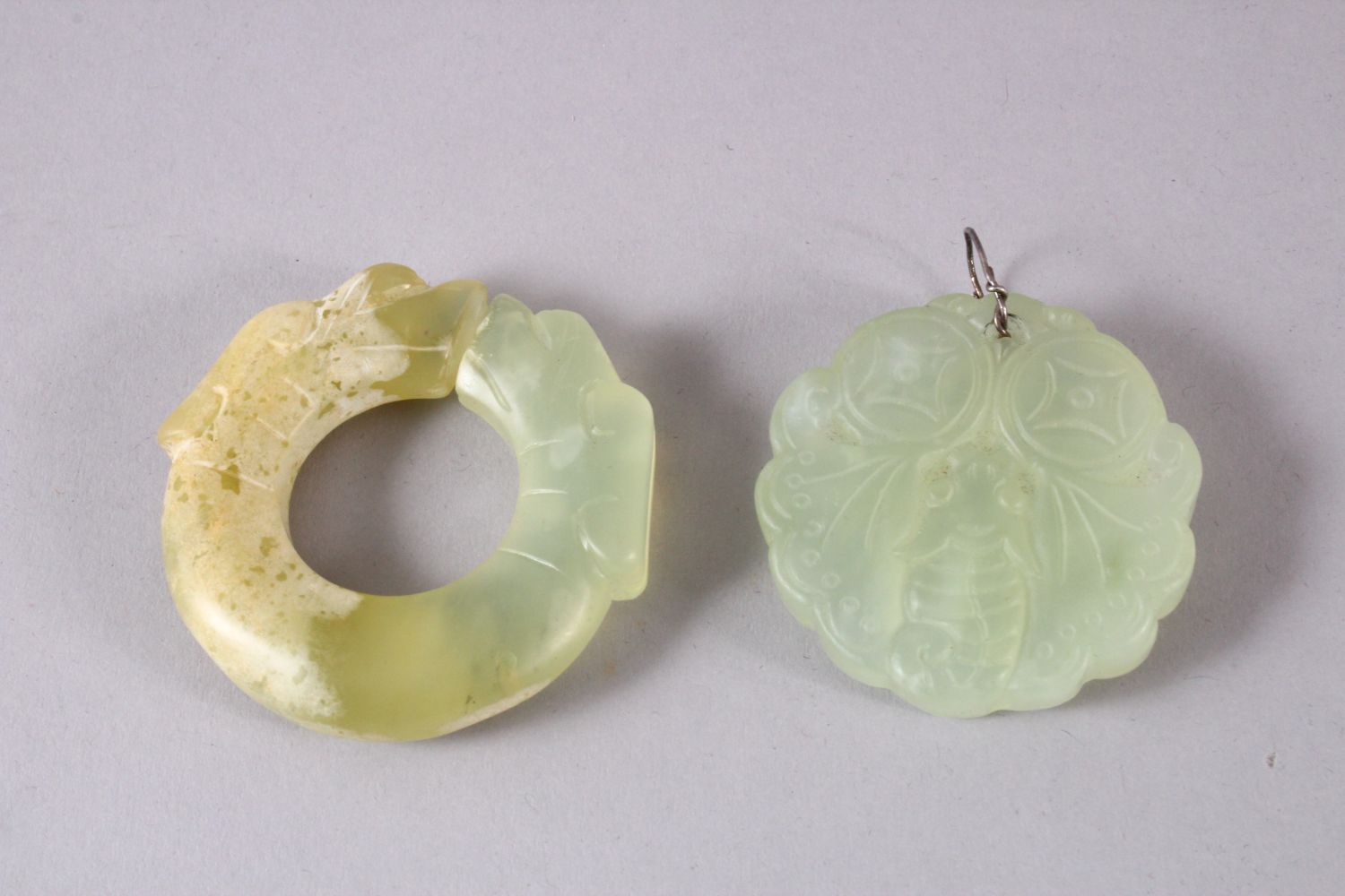 TWO CHINESE CARVED JADE BUTTERFLY & DRAGON BI DISK PENDANTS, one pale almost translucent jade carved - Image 3 of 4