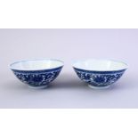 A FINE PAIR OF CHINESE MING STYLE BLUE & WHITE PORCELAIN CUPS, the cups decorated with a central