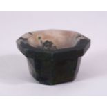 A 19TH CENTURY CHINESE OCTAGONAL JADE BRUSH WASHER, on bracket feet, 7cm diameter.