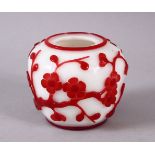 A CHINESE PEKING GLASS OVERLAID BRUSH WASH, the white body with overlaid ruby red floral decoration,
