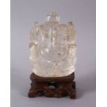 AN INDIAN CARVED ROCK CRYSTAL FIGURE OF GANESH - In a seated meditative pose, 7cm high