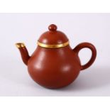 A CHINESE YIXING CLAY & GOLD METAL MOUNTED TEAPOT & COVER, the body mounted with gold coloured