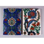 TWO IZNIK STYLE POTTERY TILE SECTIONS, one with white ground and floral motif and feather