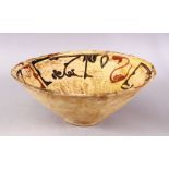 A GOOD IRAN STYLE POTTERY BOWL, decorated with a beige ground and kufic script decoration, 30cm (