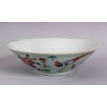 A CHINESE CELADON FAMILLE ROSE PORCELAIN BOWL, decorated with a celadon ground and butterflies,