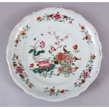 AN 18TH CENTURY CHINESE FAMILLE ROSE PORCELAIN PLATE, decorated with native floral decoration, 25cm