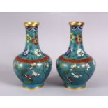 A PAIR OF 19TH / 20TH CENTURY CHINESE CLOISONNE VASES, with a turquoise ground and floral