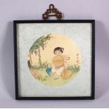 A SMALL CHINESE FRAMED PAINTING ON SILK - the cut out section depicting a young girl seated in a