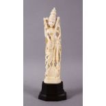 A 19TH CENTURY INDIAN CARVED IVORY FIGURE OF SARASWATI, 19cm high.