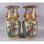 A PAIR OF 19TH CENTURY CHINESE CANTON FAMILLE ROSE PORCELAIN VASES, each with panel decoration of