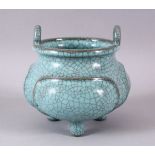 A CHINESE PALE BLUE GUAN GLAZED PORCELAIN TRIPOD CENSER, with moulded panel section, tripot feet and