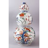 A 18TH / 19TH CENTURY CHINESE FAMILLE VERTE TRIPLE GOURD PORCELAIN VASE, decorated with an array