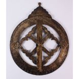 AN ISLAMIC CHASED COMPASS, with chased calligraphy and symbols and a revolving hand, 36cm widest