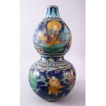 A CHINESE MING FAHUA DOUBLE GOURD PORCELAIN CARVED VASE, decorated with figures including luohan,