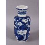 A 19TH CENTURY CHINESE BLUE AND WHITE PRUNUS ROULEAU VASE, the base with Kangxi mark, 15cm high.