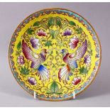A CHINESE FAMILLE JAUNE OR YELLOW GROUND PORCELAIN DISH, decorated with twin birds amongst flora,