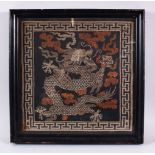A CHINESE FRAMED FIVE CLAW DRAGON TAPESTRY, the five claw dragon and clouds detailed in metallic