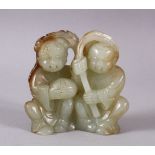 A CHINESE CARVED CELADON JADE FIGURE OF TWO BOYS, both seated holding branches, 8cm.