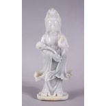 A CHINESE CARVED JADEITE FIGURE OF GUANYIN / DEITY , stood holding a ruyi and with one hand aloft