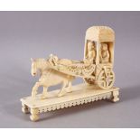 A 19TH CENTURY INDIAN CARVED IVORY CONVEYANCE, 11cm long.