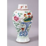 AN 18TH CENTURY YONGZHENG PERIOD FAMILLE ROSE/VERTE VASE, painted with flowers and phoenix, 25cm