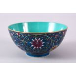 A CHINESE POLY CHROME GLAZED LOTUS PATTERN BOWL, the interior with turquoise ground, yungtchen