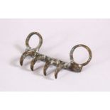 A RARE 19TH CENTURY SIKH TIGER CLAW WEAPON, 9cm wide.