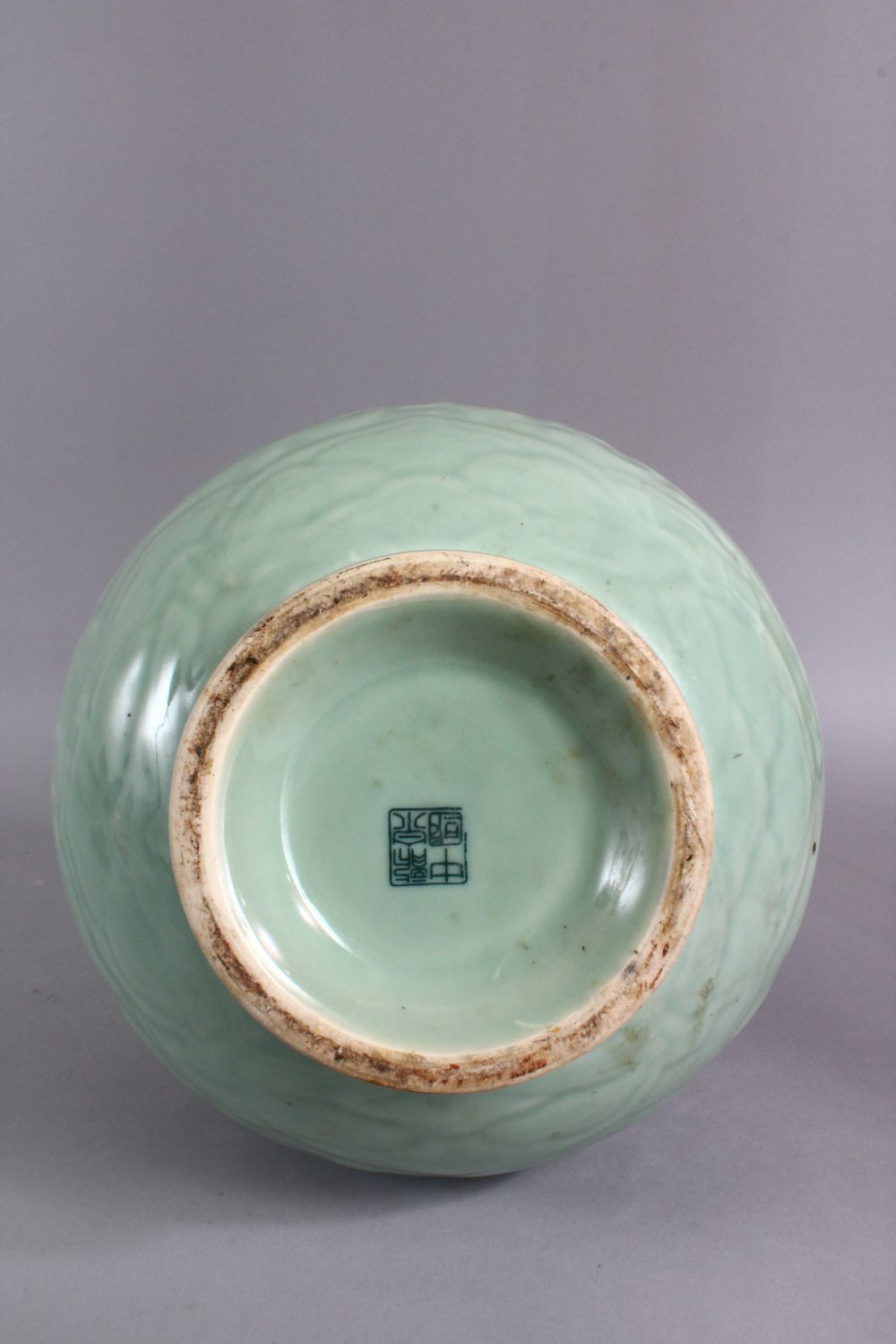 A LARGE CHINESE CELADON PORCELAIN TWIN HANDLE VASE, the body with carved floral decoration beneath a - Image 8 of 9