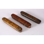 THREE 19TH CENTURY PERSIAN QAJAR LACQUER PEN BOXES, 23cm long.