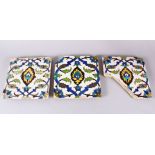 A SET OF THREE EARLY SAFAVID POTTERY TILES, each with the same decoration, white ground ith blue