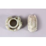 TWO CHINESE CARVED JADE PENDANTS, one carved with chilong, 5cm, and one carved int he form of a