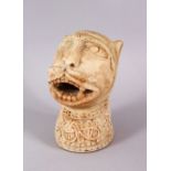 AN EARLY ISLAMIC CARVED MARBLE LIONS HEAD FIGURE, the lion bearing its teeth looking aloft, with
