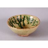 A 13TH CENTURY SMALL SCRAFFITO POTTERY BOWL, with carved borders and green splash, 9cm.