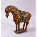 A CHINESE MING SANCAI GLAZED POTTERY HORSE, 24cm