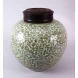 A 19TH / 20TH CENTURY CHINESE CELADON GLAZED PORCELAIN GINGER JAR & HARDWOOD COVER, the body of