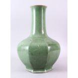 A LARGE CHINESE CRACKLEGLAZE GREEN OCTAGONAL BULBOUS VASE, 43cm high.