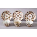 THREE JAPANESE MEIJI PERIOD ARITA PORCELAIN CUP & SAUCERS, with filt and orange floral decoration,