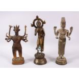 THREE EARLY/MID-20TH CENTURY ORIENTAL BRONZE FIGURES, 25cm, 24cm and 21cm high.