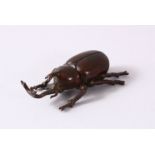 A JAPANESE BRONZE FIGURE OF A LONG MOUTH BEETLE - the base with a seal mark, 7cm