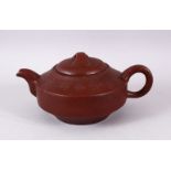 A CHINESE YIXING CLAY CALLIGRAPHIC TEAPOT, the body of the pot with calligraphy, the base with a six