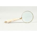 A MAGNIFYING GLASS WITH MOTHER OF PEARL HANDLE