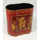 A RED TOLEWARE BIN with Chinese designs. 11ins high