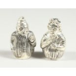 A PAIR OF .800 PUNCH AND JUDY SALT AND PEPPERS