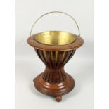 A DUTCH MAHOGANY JARDINIERE with brass liner. 1ft 4ins high